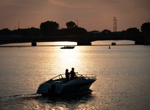 Couple on boat at sunset