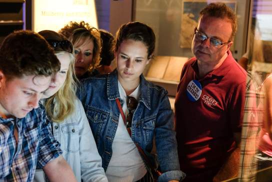 A group of people looks at an exhibit at The D-Day Story in Portsmouth