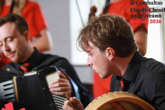 Musicians playing traditional Irish instruments as part of Fleadh