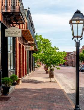 The road, sidewalks, and buildings are all made of brick in Historic Main Street in St. Charles, MO