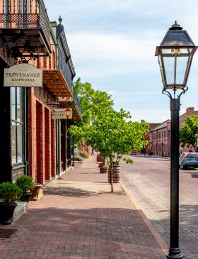 The road, sidewalks, and buildings are all made of brick in Historic Main Street in St. Charles, MO