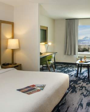 Interior of a hotel room with a view of Long's Peak