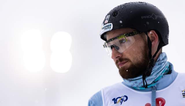 Chris Lillis from the shoulders up in ski bib, helmet and goggles