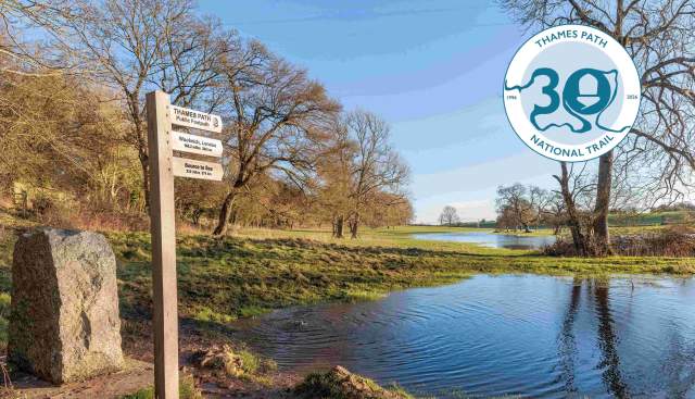 View of the source of the Thames and signpost for Thames Path