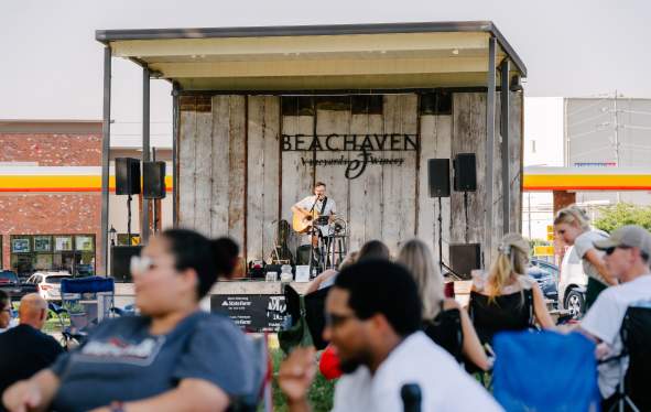 audience enjoying live music outside at a winery