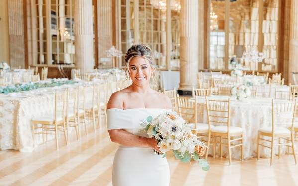 Bride stands in Grand Ballroom at Marriott Syracuse Downtown