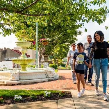 Hispanic family walking in a historic downtown