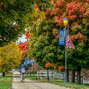 Cyclist on Bike Trail in Fall