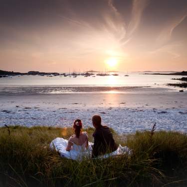 Wedding couple watching the sunset on St. Martin's