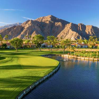 Golf Course and palm trees with a blue sky