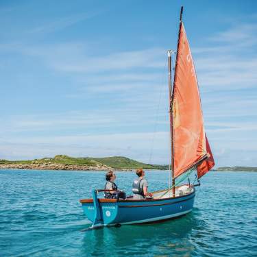 Family sailing around the islands