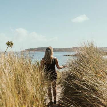 Girl on beach in autumn
