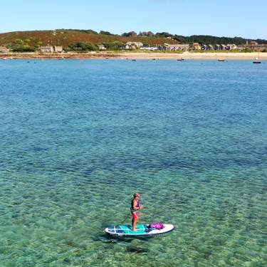 Woman on single paddleboard