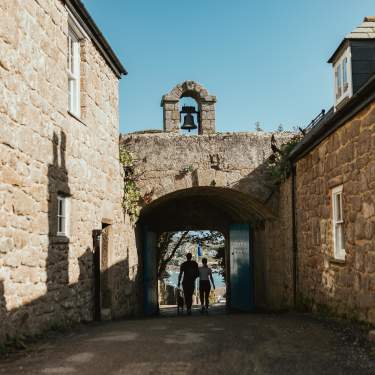 Couple walking through the Garrison Arch