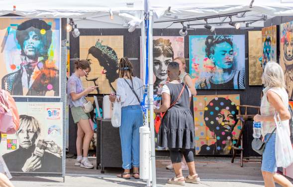 People looking at art during Ann Arbor Art Fair