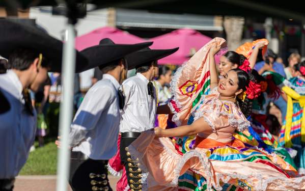 Women dancing in Pat Coursey Park in Jalisco Dresses