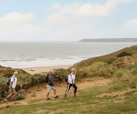 3 walkers in sand dunes