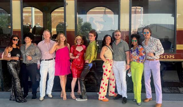 People dressed up in disco attires before they ride on the Grapevine Vintage Railroad's Disco Wine Trail