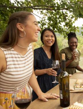 Women enjoying wine pairings during their girlfriend's getaway in Loudoun County