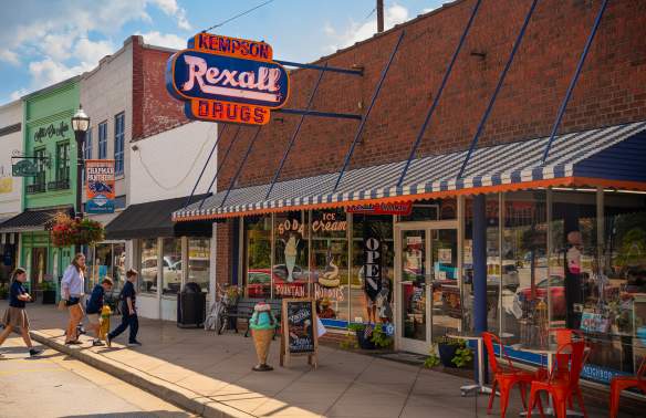 Family walking into Kempson Rexall