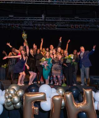 Excellence in Hospitality 2024 Staff Photo on Stage