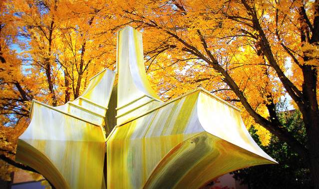 Art Statue under Fall Leaves