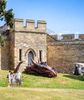 Images shows two huge dragons, residing in the grounds of Lincoln Castle