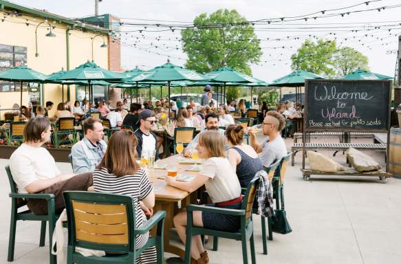 A large group dining on Upland's patio