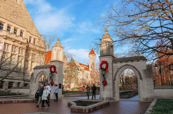 People walking through Sample Gates during a winter day