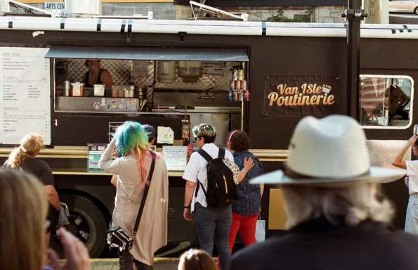People ordering from a food truck.
