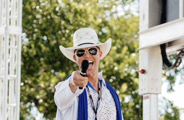Cowboy posing for a photo in a white Elvis-Inspired Outfit
