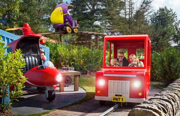 a family on the Postman Pat ride at CBeebies Land