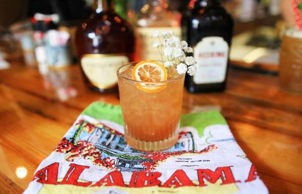 cocktail with orange garnish