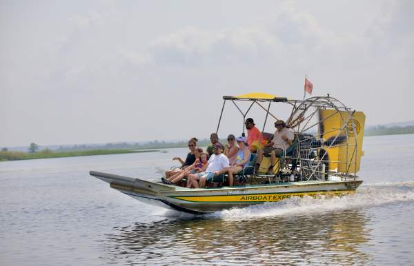 Group of people riding an airboat