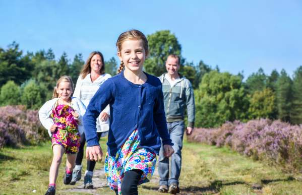 Cannock Chase heathland family walking girls running ahead