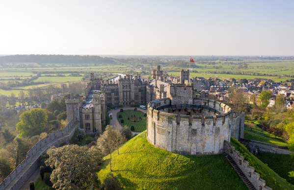 Aerial view of the keep at Arundel Castle with Arundel and fields in the distance