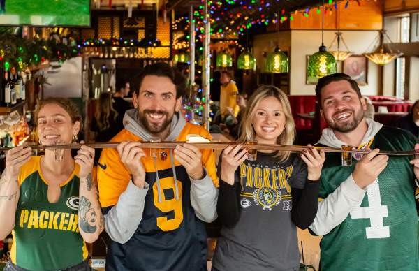 Friends doing a shotski in Buckatabon Tavern