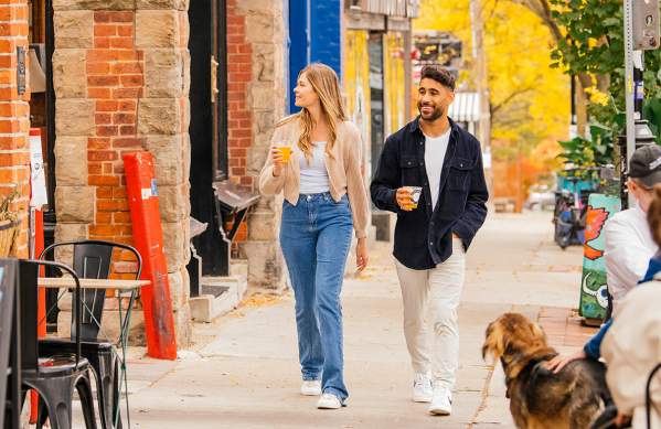 Couple walking down sidewalk in downtown Ann Arbor