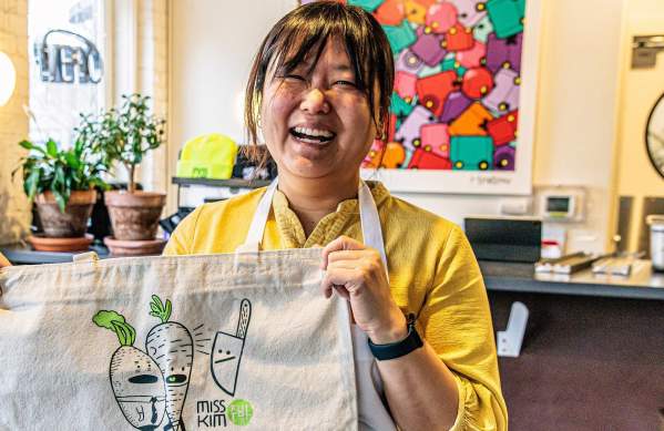 Chef Ji Hye Kim stands inside of Miss Kim