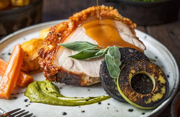 Roast pork dish at The Square Club in central Bristol - credit The Square Club