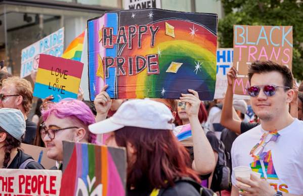People holding banners in the Bristol Pride parade - Credit Matt Whiteley