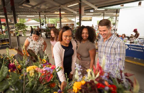 Group of people looking at items at the Ann Arbor Farmers Market