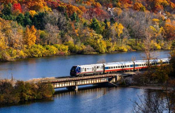 Amtrack Train crossing Huron River in Fall