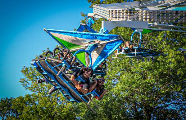 Group of friends on a carnival ride at Banks of the Wabash Festival in Terre Haute, Indiana