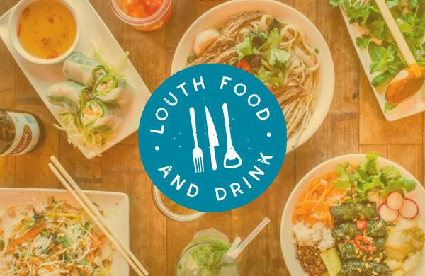 a table of food with the 'Louth food & drink' logo on top