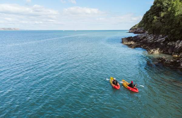 Two people kayaking in Swansea