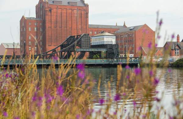 Grimsby docks river with industrial buildings in background