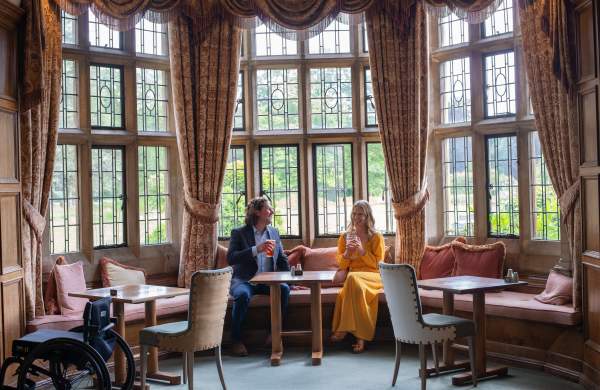 Two people enjoying a beverage inside the petwood hotel