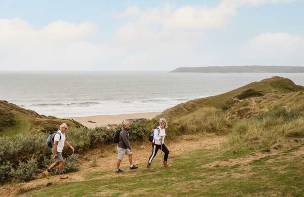 3 walkers in sand dunes