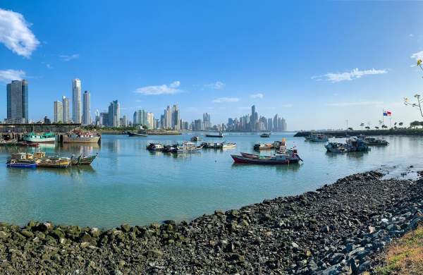 Fishing boats, sunny day with Panama City skyline in the background